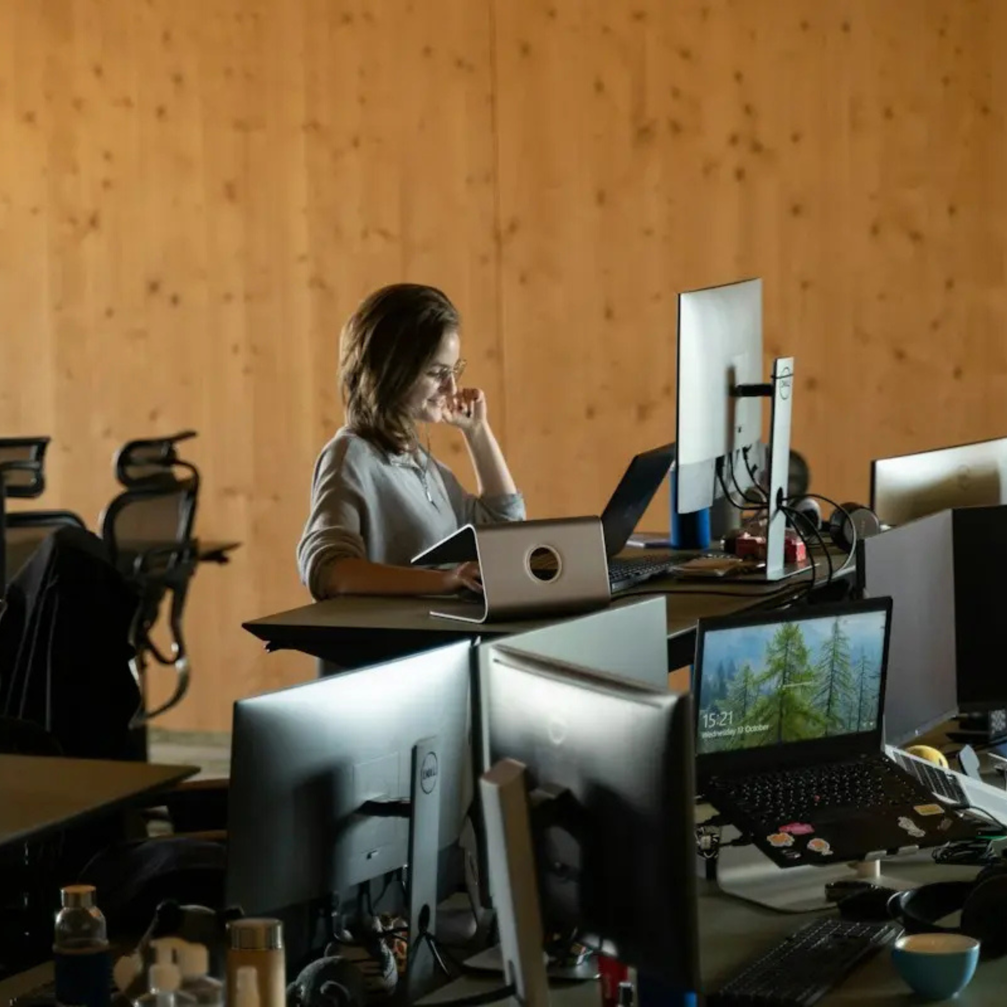 A recruiter alone at her desk in an empty office on Monday morning, reading through what the agent left in her queue.
